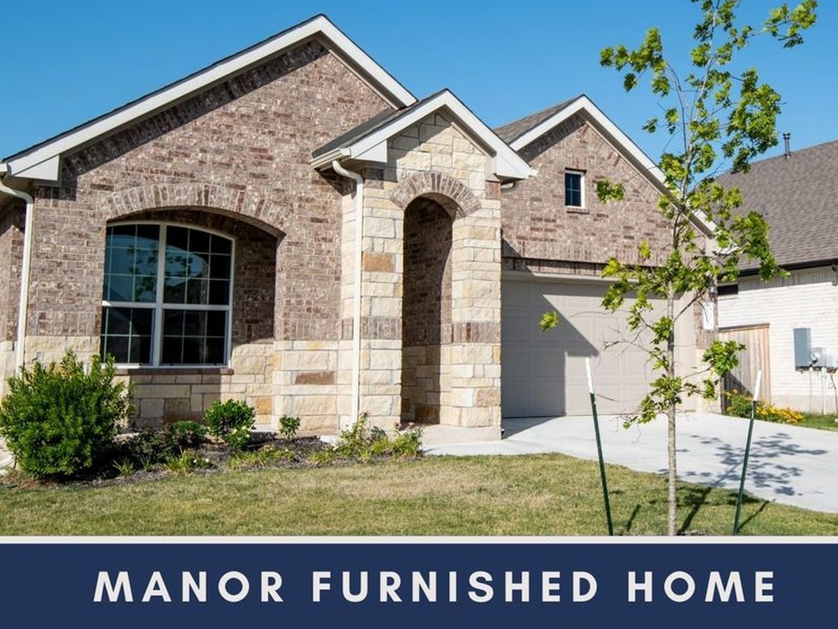 Brick and stone exterior of the single-family home on Mc Arthur Drive in Manor, Texas